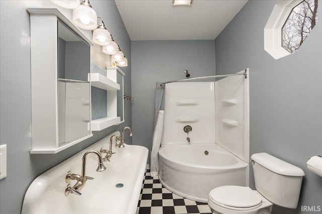 bathroom with toilet and washtub / shower combination