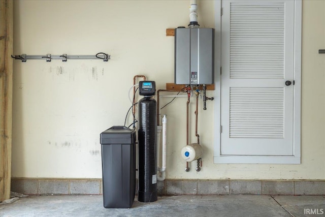 utility room featuring water heater