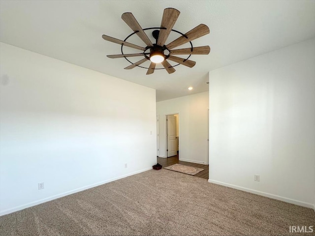 empty room featuring carpet floors and ceiling fan