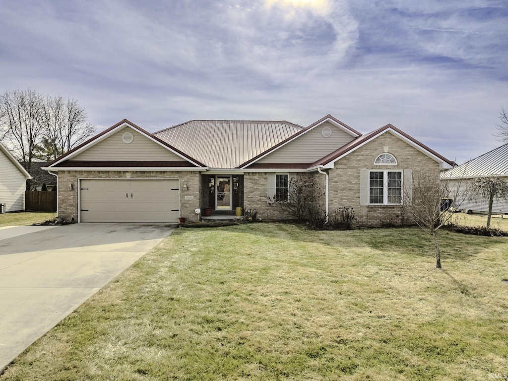 ranch-style home with a garage and a front yard