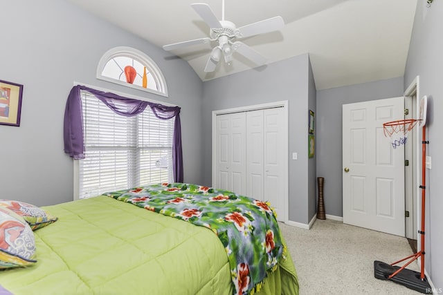 bedroom with vaulted ceiling, a closet, and ceiling fan