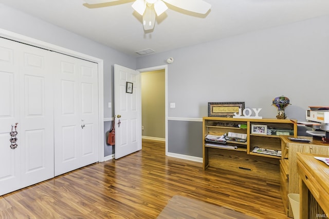 office space featuring wood-type flooring and ceiling fan