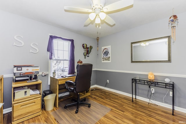 office with hardwood / wood-style flooring and ceiling fan