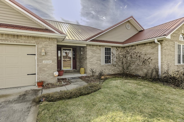 view of front of house with a garage and a front yard