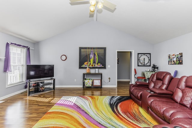 living room featuring vaulted ceiling, dark hardwood / wood-style floors, and ceiling fan