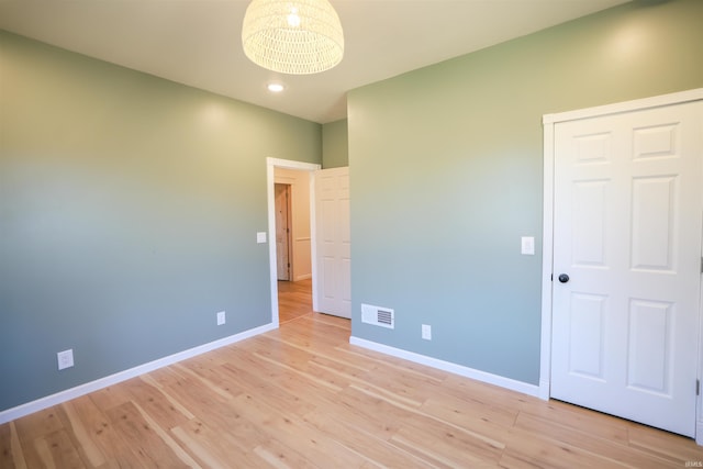 unfurnished bedroom with light hardwood / wood-style flooring