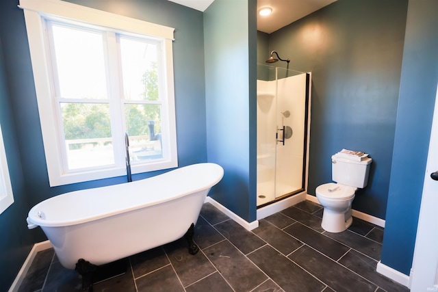 bathroom featuring toilet, tile patterned flooring, and shower with separate bathtub