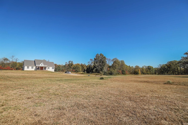 view of yard with a rural view