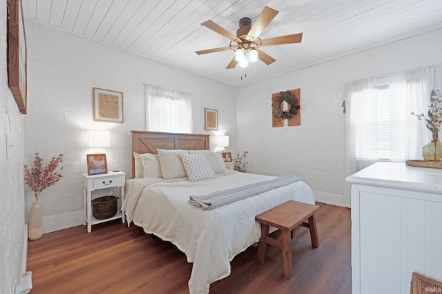 bedroom with wood ceiling, ceiling fan, and dark hardwood / wood-style floors