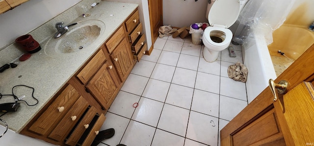 full bathroom featuring vanity, shower / tub combo, tile patterned floors, and toilet