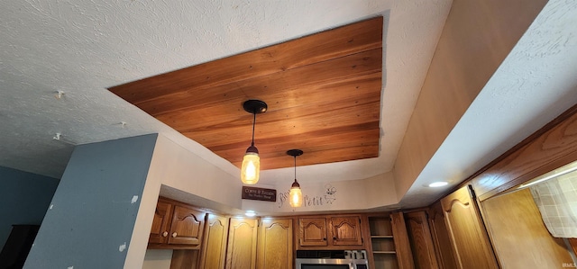 room details with hanging light fixtures and wooden ceiling