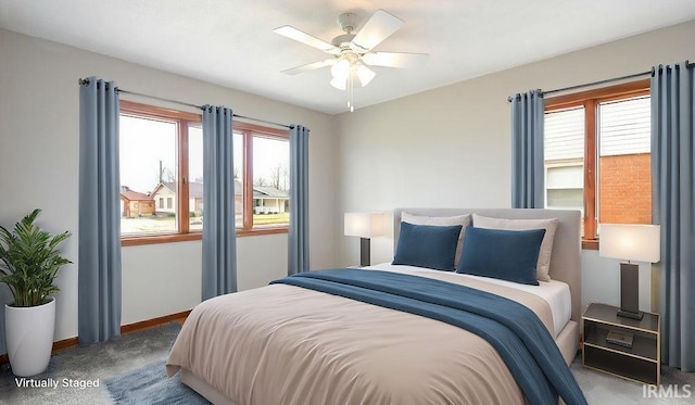 carpeted bedroom with ceiling fan