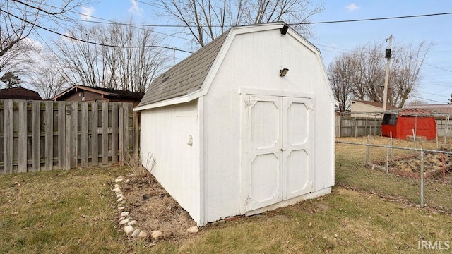 view of outdoor structure featuring a lawn