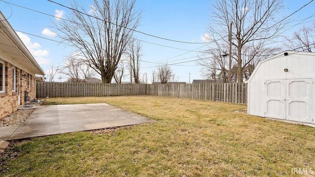 view of yard featuring a patio and a storage unit