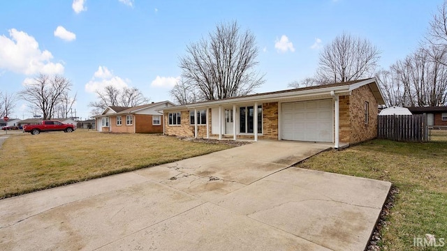 single story home with a garage and a front yard