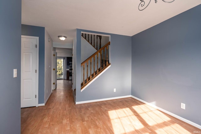 spare room with hardwood / wood-style flooring