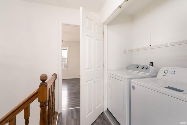 laundry area featuring dark wood-type flooring and washing machine and dryer