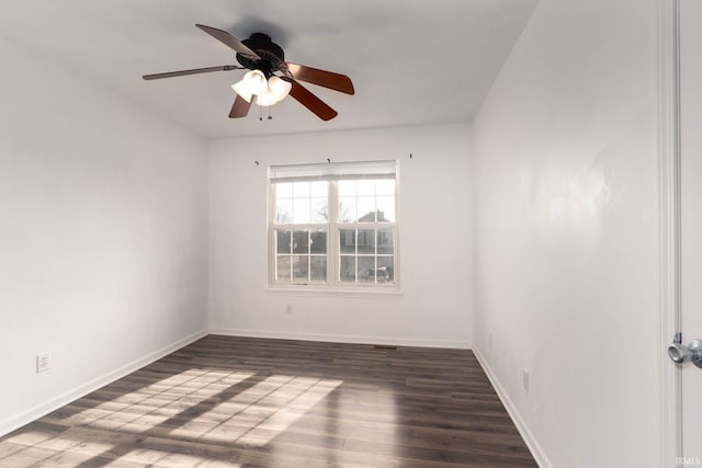 unfurnished room with ceiling fan and dark hardwood / wood-style flooring