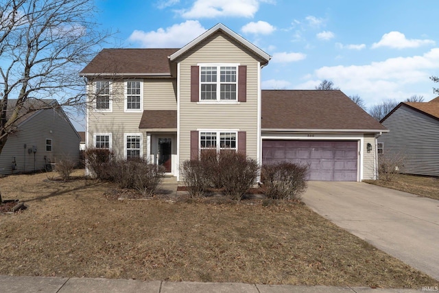 view of front of home featuring a garage and a front yard