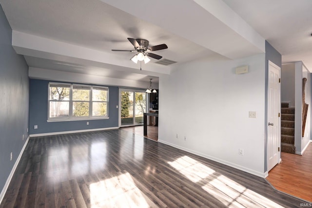 empty room featuring dark wood-type flooring and ceiling fan