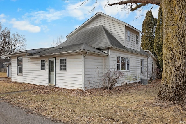 view of property exterior with central AC unit