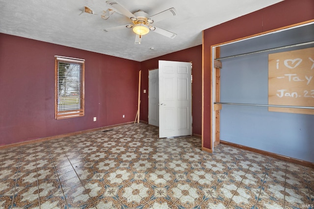 unfurnished bedroom with ceiling fan, vaulted ceiling, and a textured ceiling