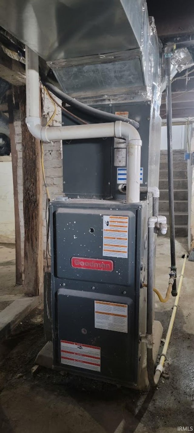 utility room featuring heating unit