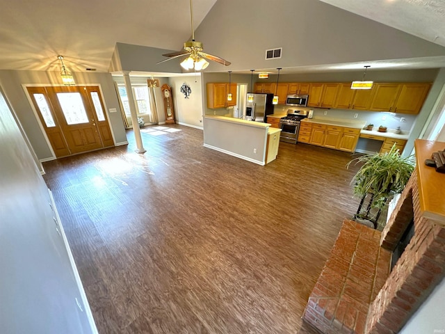 unfurnished living room featuring ornate columns, ceiling fan, high vaulted ceiling, and dark hardwood / wood-style flooring