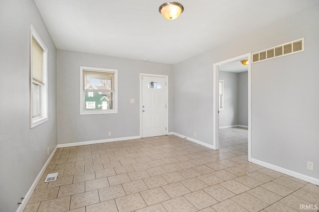 foyer with light tile patterned floors