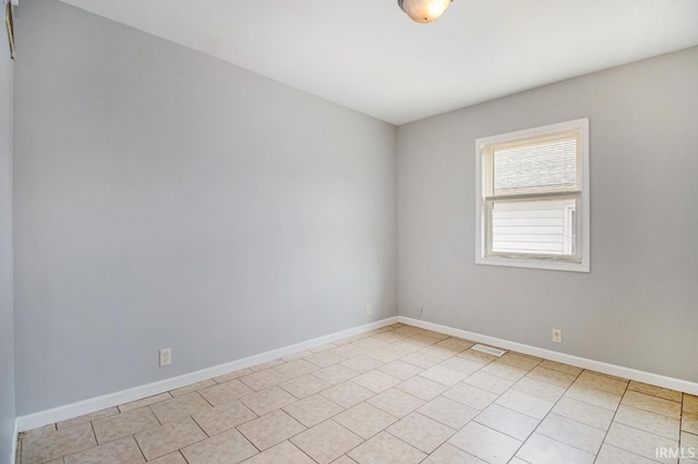 view of tiled spare room