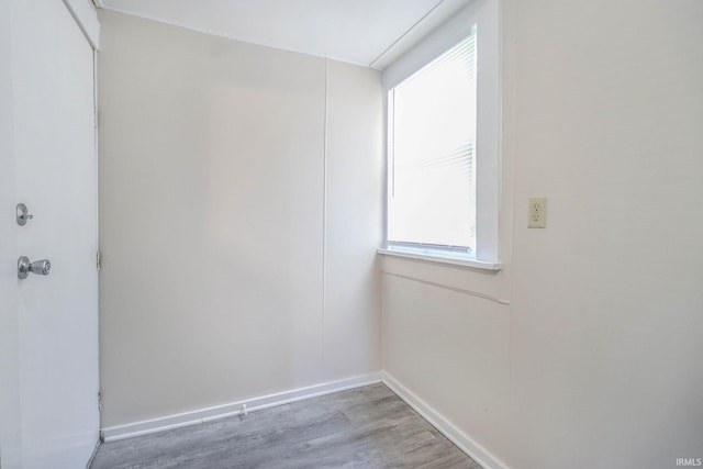 unfurnished room featuring hardwood / wood-style floors