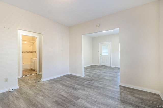 unfurnished room featuring hardwood / wood-style floors