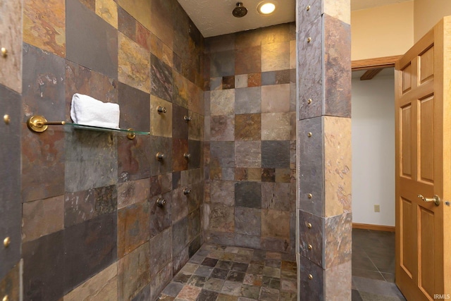 bathroom with a tile shower