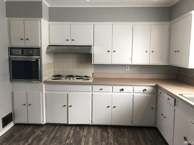 kitchen with white cabinets, dark hardwood / wood-style floors, oven, and white gas cooktop