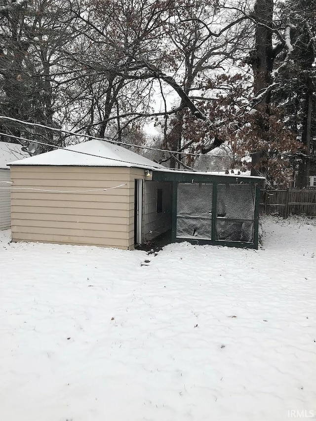 view of snow covered garage