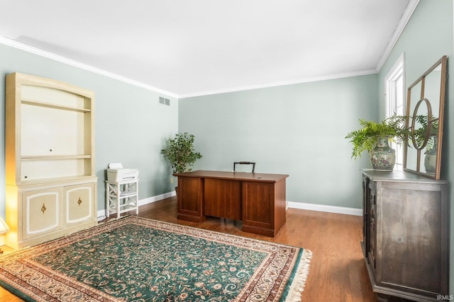 home office featuring hardwood / wood-style flooring and ornamental molding