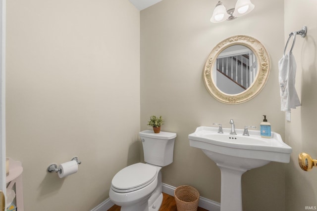 bathroom featuring sink and toilet