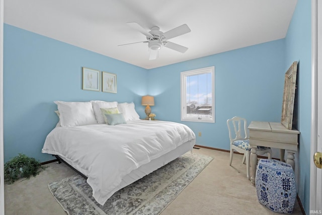 bedroom featuring ceiling fan and light carpet