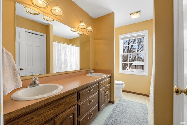 bathroom with vanity and toilet