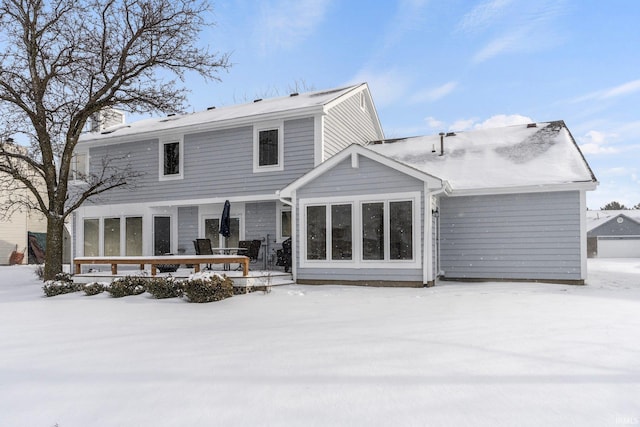 view of snow covered house