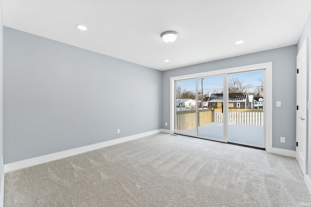 spare room with light colored carpet