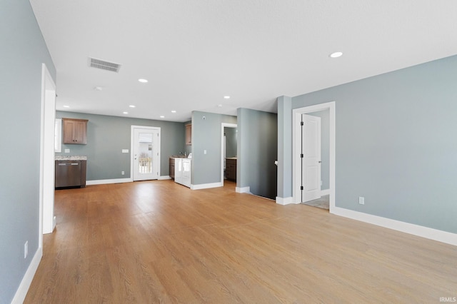 unfurnished living room with light wood-type flooring