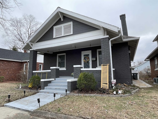 view of front of home featuring a porch and central AC unit