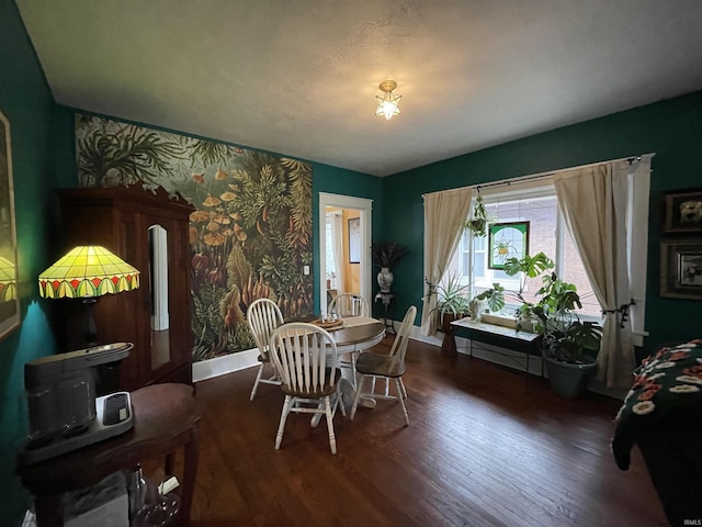 dining space featuring dark wood-type flooring