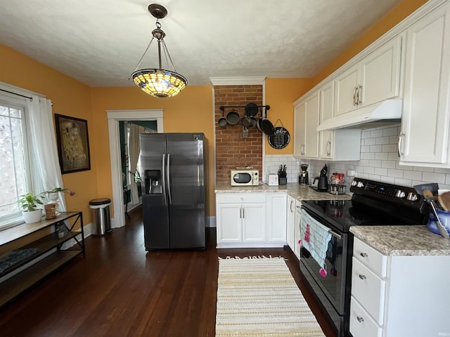 kitchen featuring stainless steel refrigerator with ice dispenser, decorative light fixtures, black electric range, dark hardwood / wood-style floors, and white cabinets