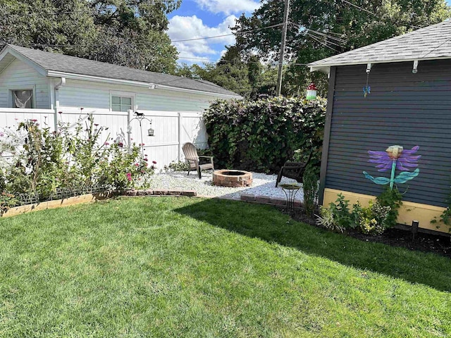 view of yard with an outdoor fire pit and a patio