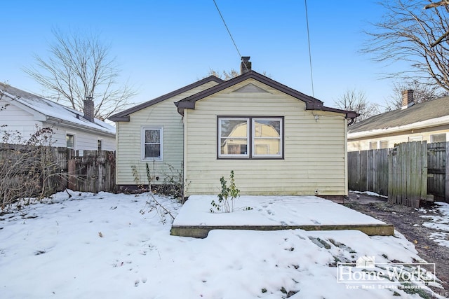 view of snow covered house