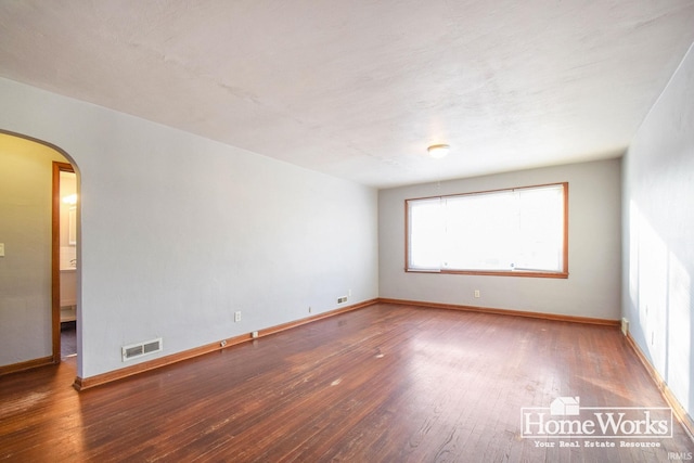 unfurnished room featuring wood-type flooring