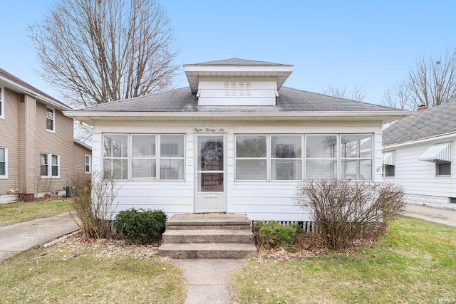 bungalow with a front lawn