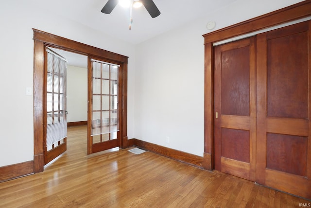 unfurnished room featuring ceiling fan and light wood-type flooring